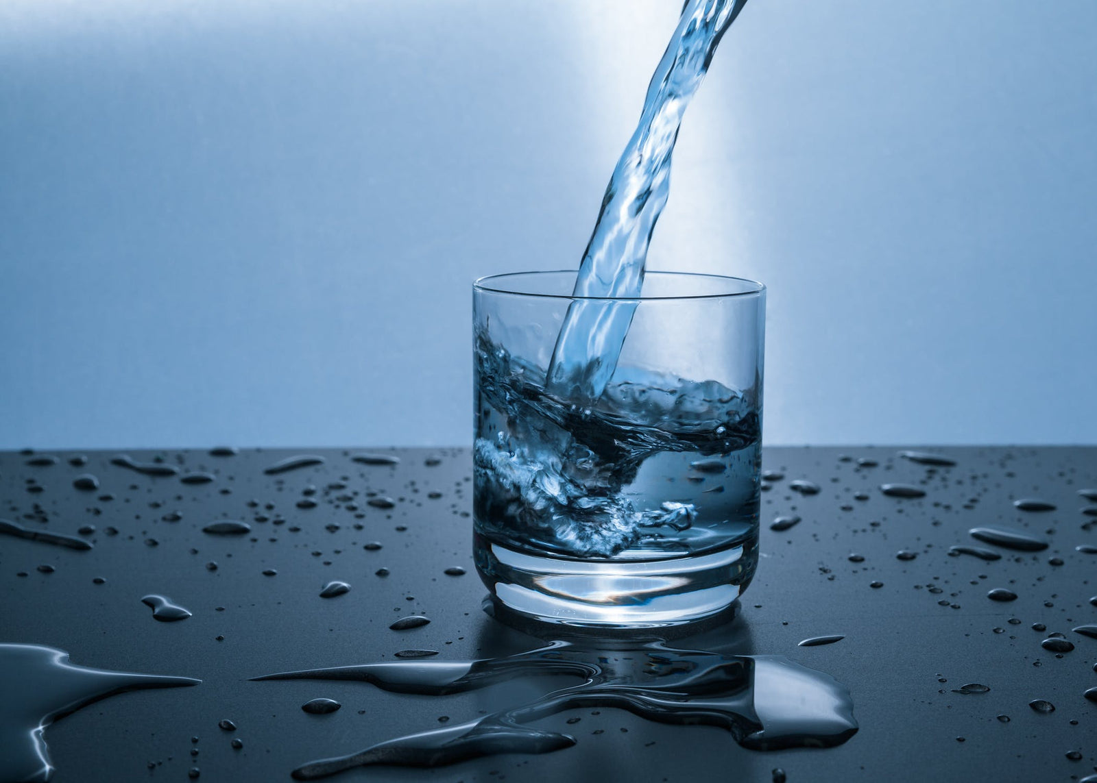 pouring water to cup