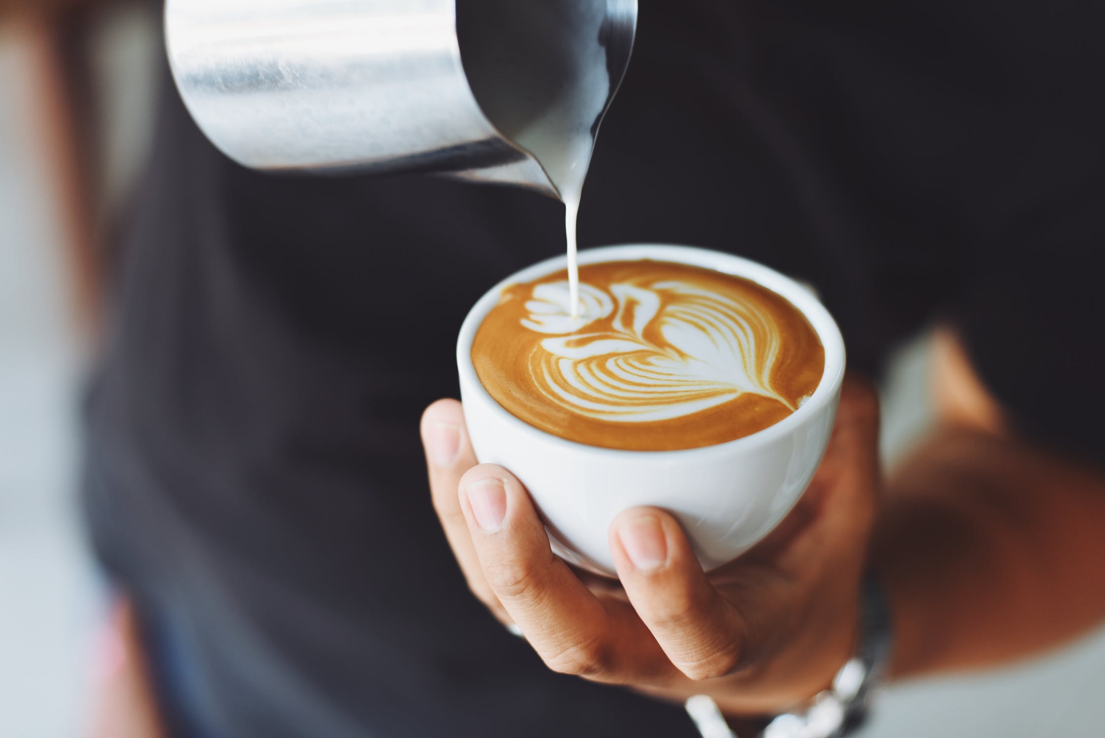 pouring coffee on cup