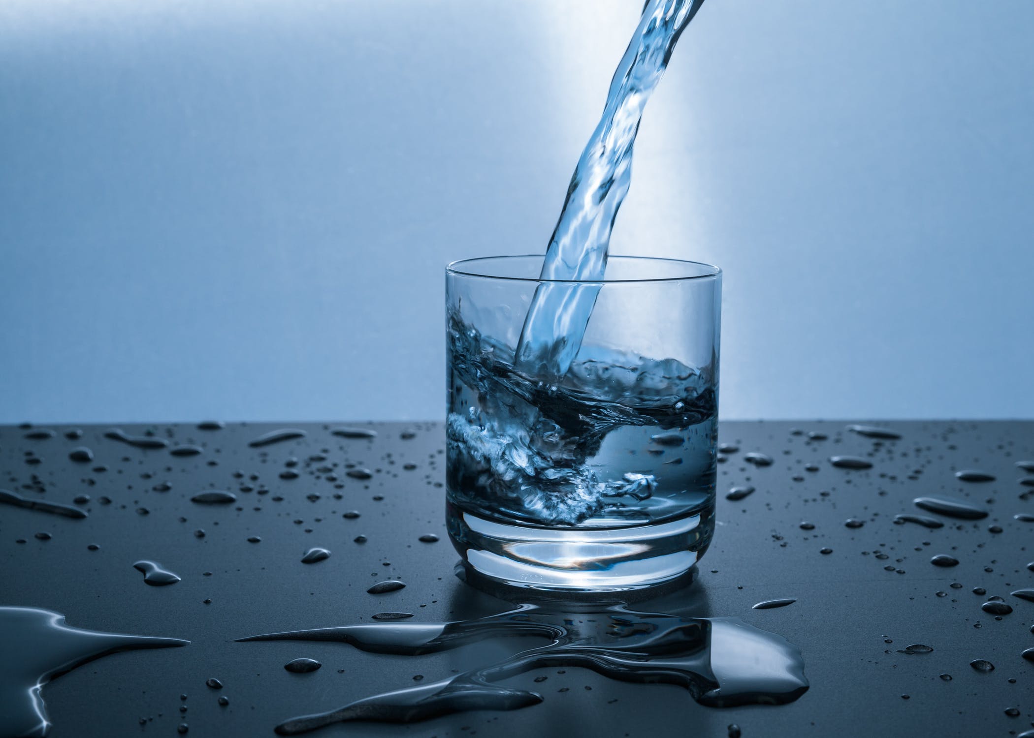 pouring water to cup