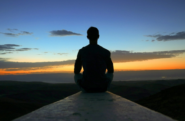 men meditation in sunset