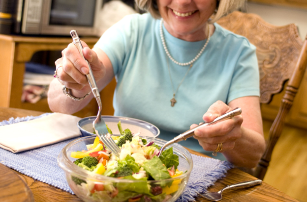 women mixing a salad